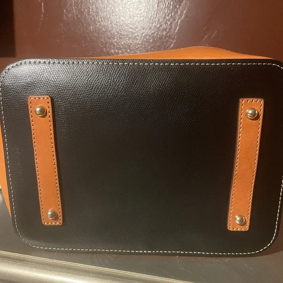 Dooney and Bourke, black and tan medium bucket bag with drawstring gently used - Picture 2 of 3